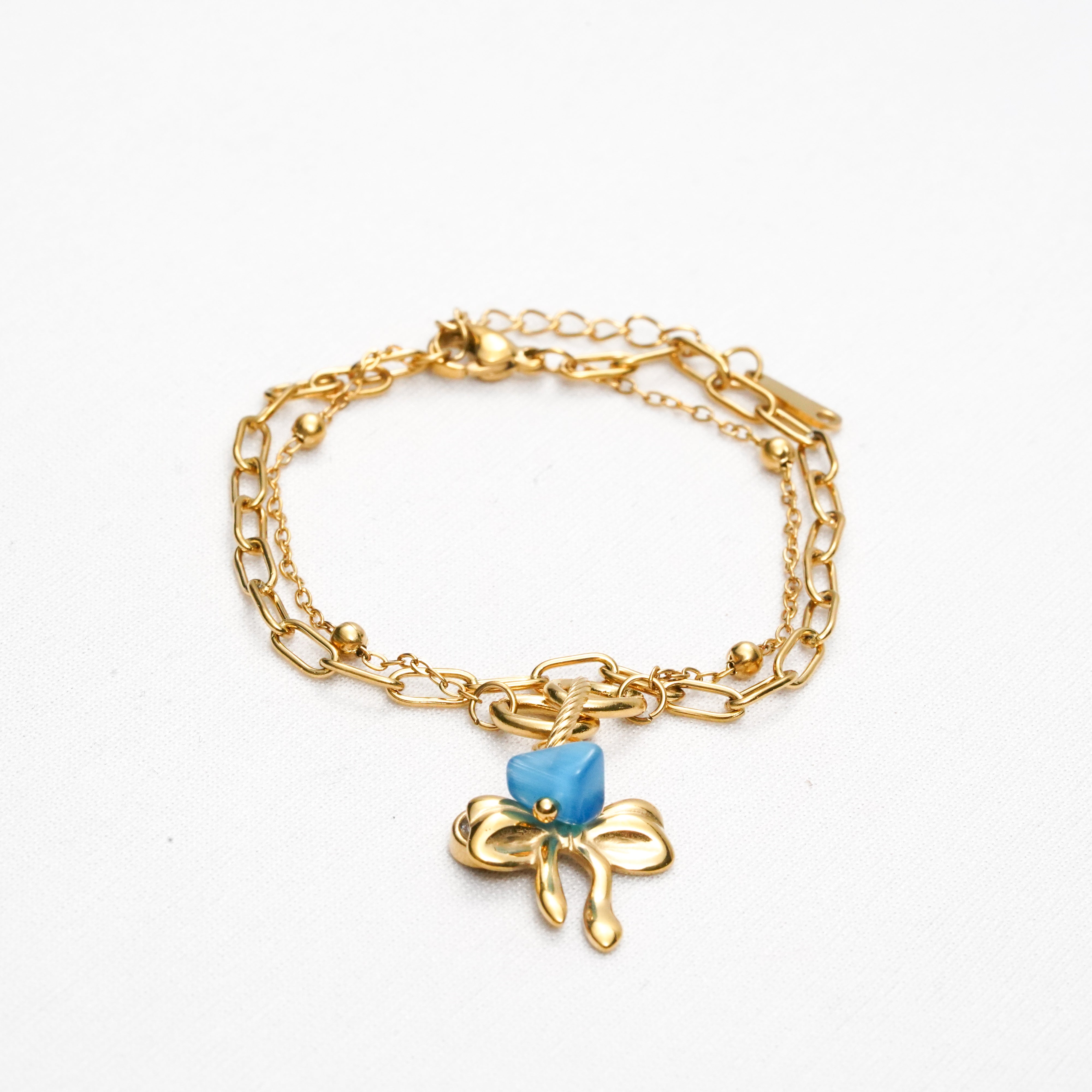 Azure Bow Charm Strand Bracelet