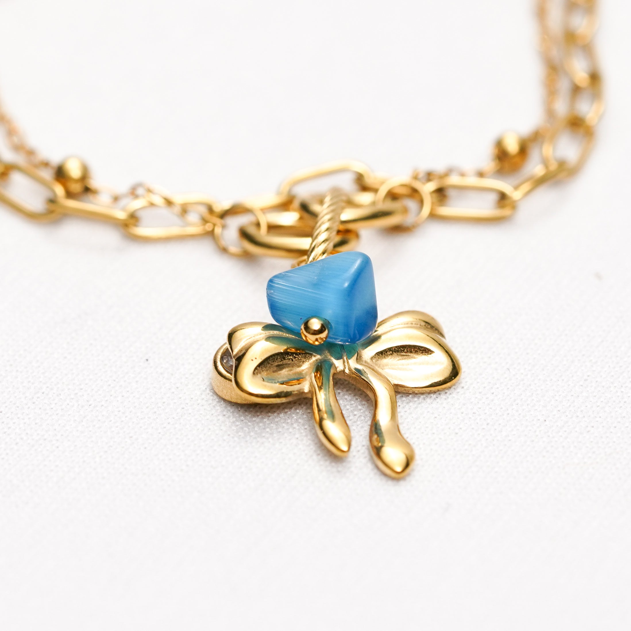 Azure Bow Charm Strand Bracelet