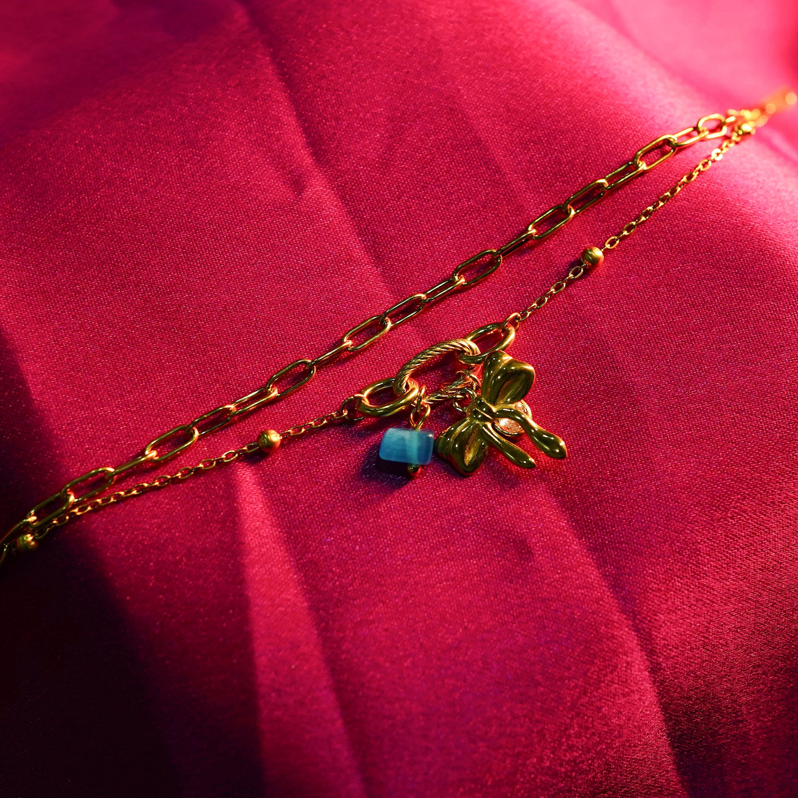 Azure Bow Charm Strand Bracelet