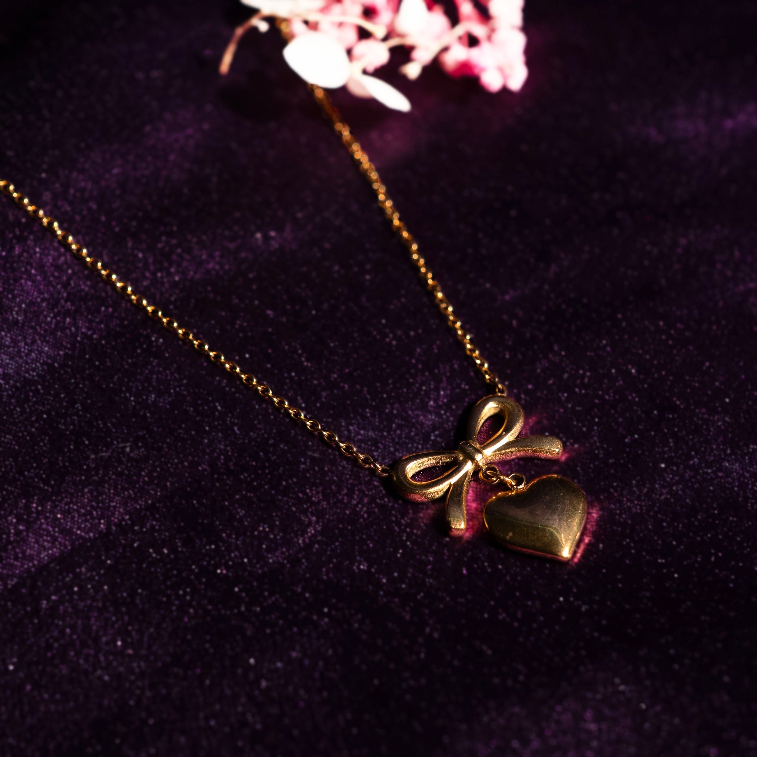 Bow Knot with Heart Pendant Design