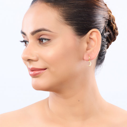 Edge Celestial Moon & Star Mismatched Huggie Earrings – CZ crescent moon and starburst huggie earrings in gold-2