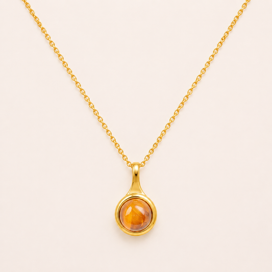 Chinoiserie-inspired round gold pendant necklace with Eastern artistic motif design