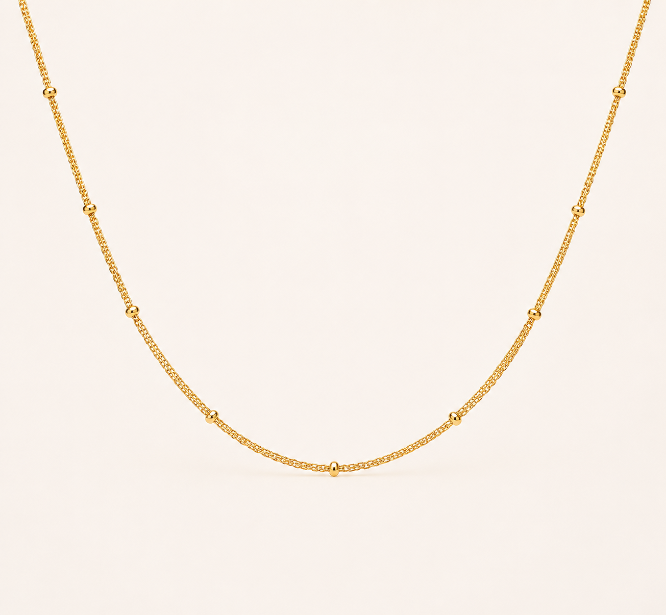 Classic Figaro pattern gold chain necklace with alternating links and high-polish finish