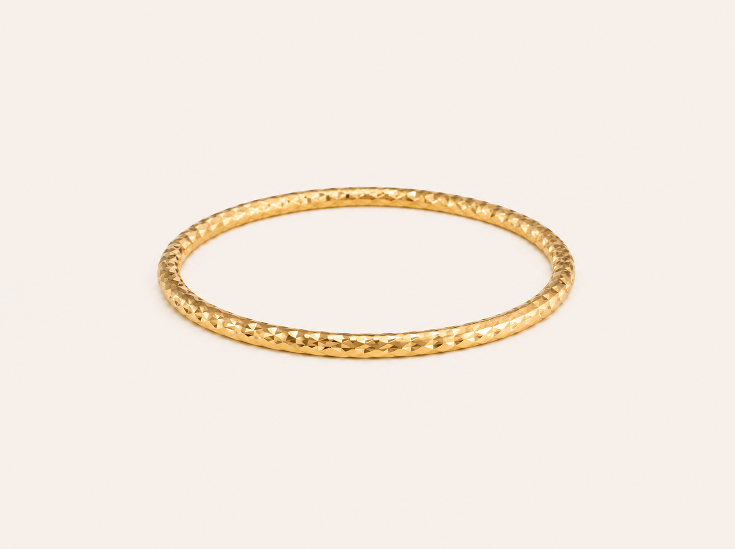 Classic geometric profile smooth gold bangle with elegant flat finish for daily stacking
