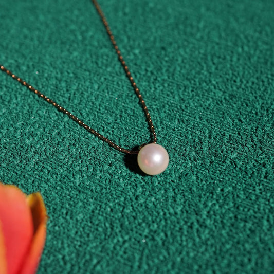 Classic luminous round gold pendant necklace with high-shine polished finish on fine chain-5