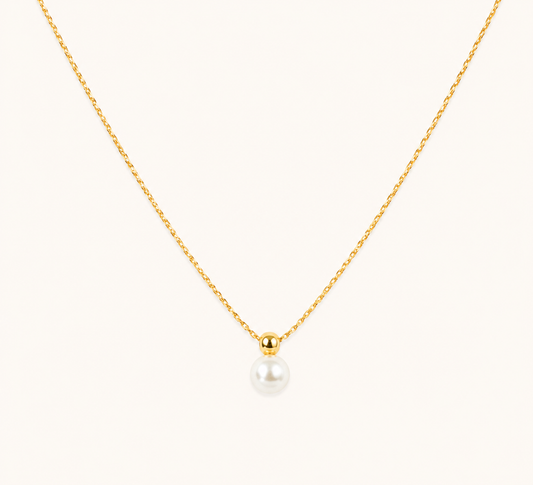 Classic luminous round gold pendant necklace with high-shine polished finish on fine chain