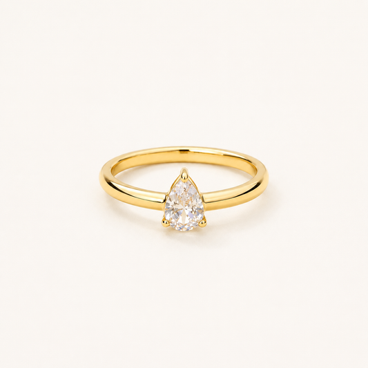 Classic pear-cut teardrop CZ solitaire ring with smooth high-polish gold-tone band