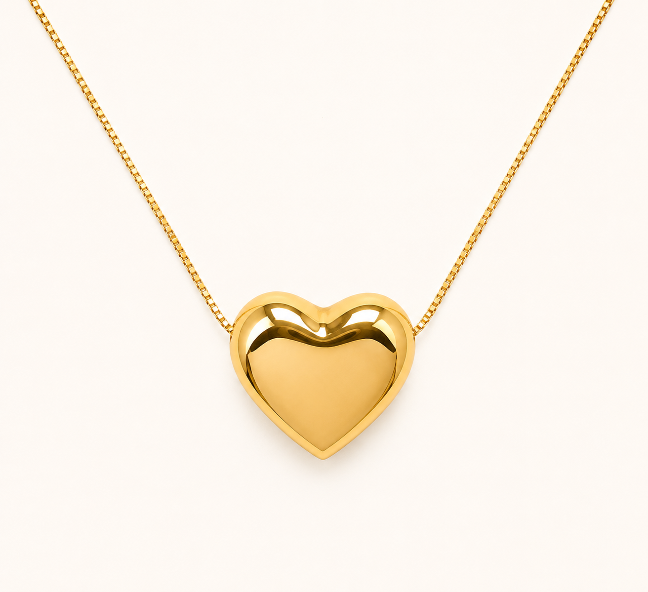 Classic soft heart pendant gold necklace with polished gold-tone finish on fine chain