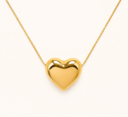 Classic soft heart pendant gold necklace with polished gold-tone finish on fine chain