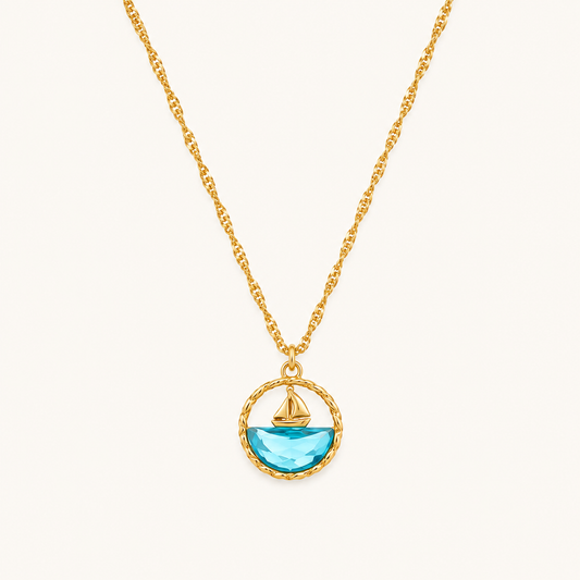 Dopamine Ocean Sailboat Pendant Necklace – round blue enamel sailboat motif pendant in gold plated finish
