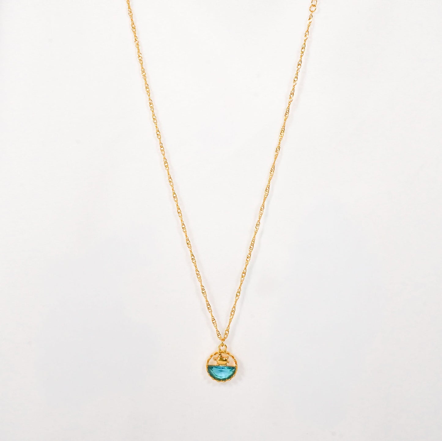 Dopamine Ocean Wave Pendant Necklace – wave-pattern blue enamel pendant in textured gold plated frame