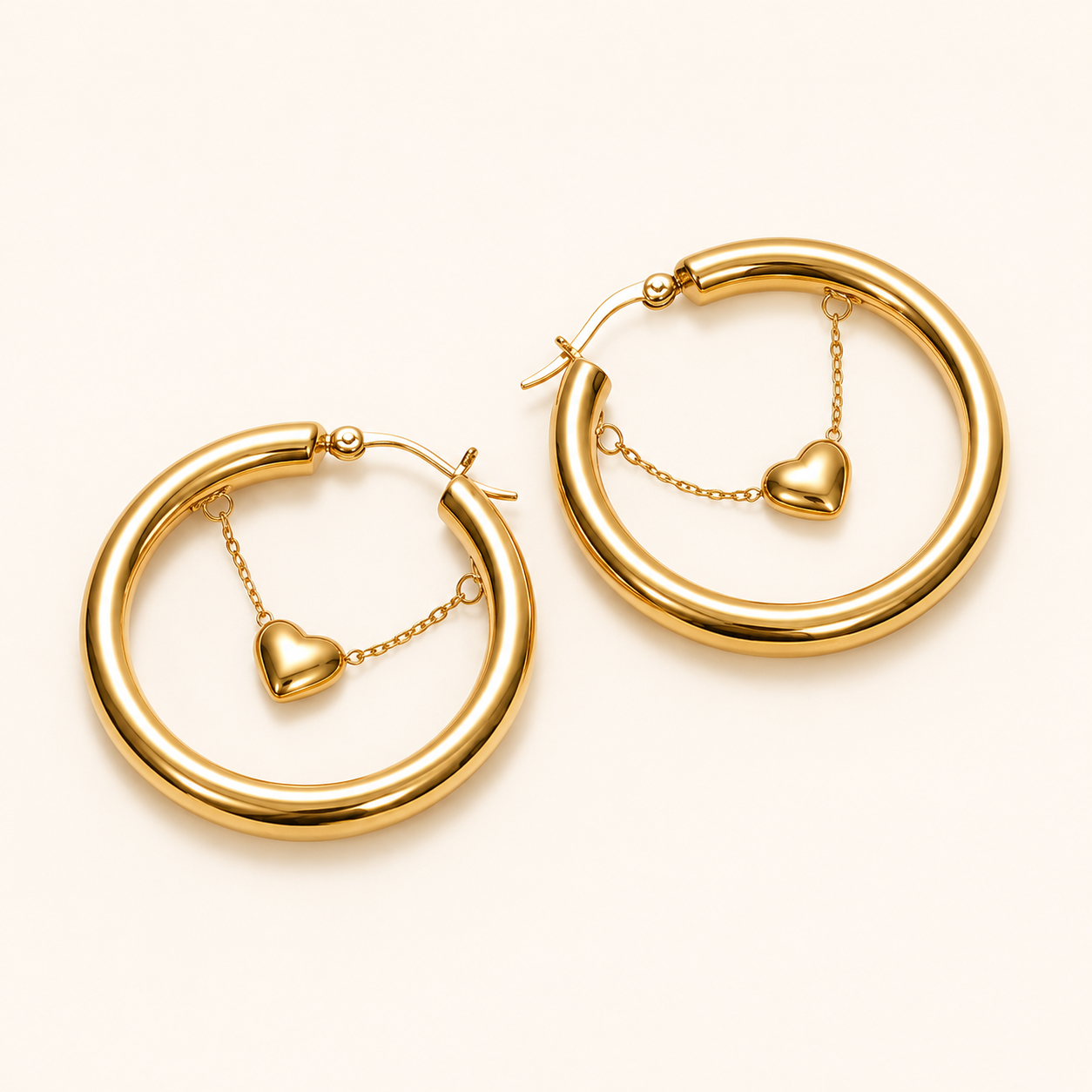 Edge Heart Charm Statement Hoop Earrings – 40mm gold plated statement hoops with suspended heart charm