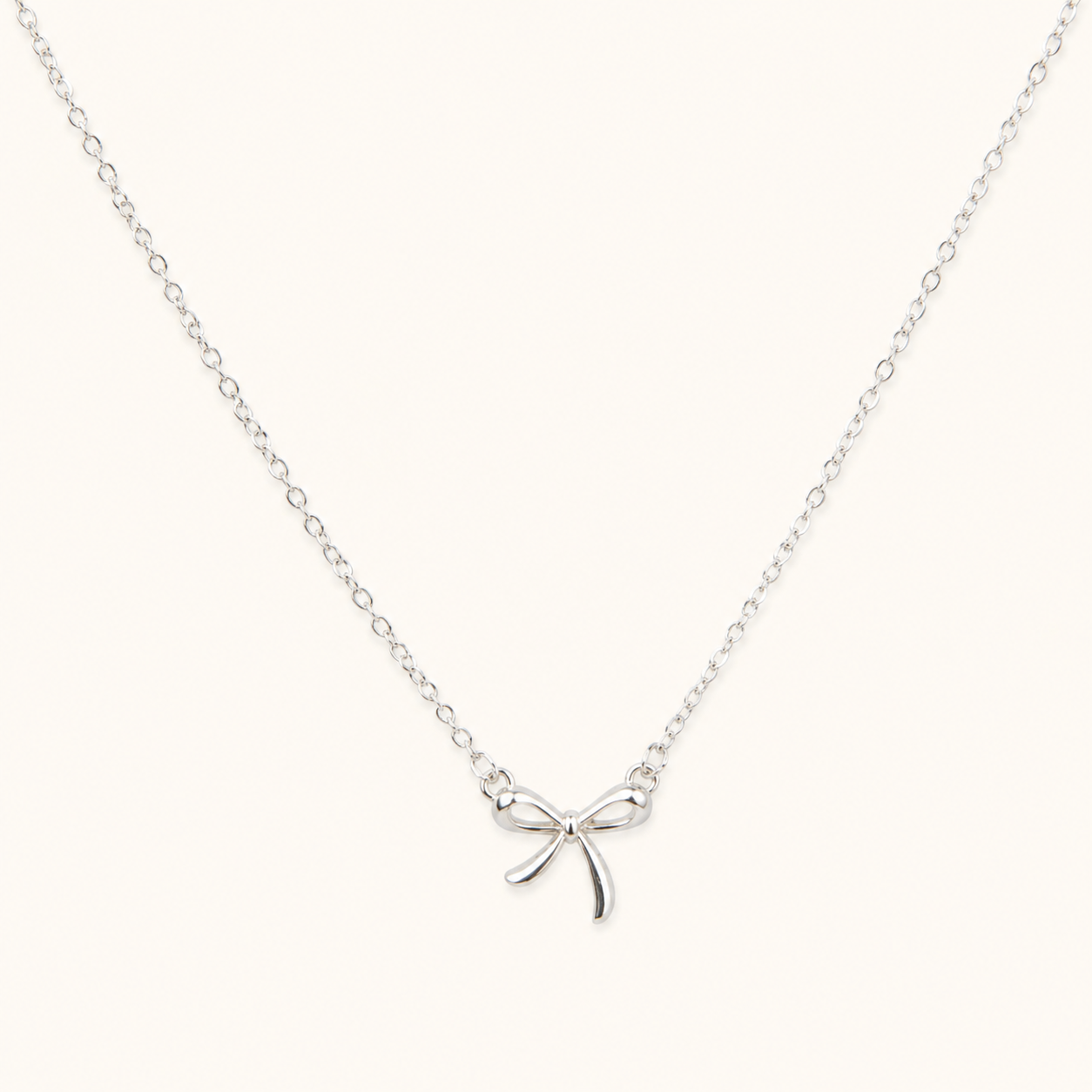 Elara Bow Knot Chain Necklace – slim gold link chain with bow knot accent, adjustable, 18K gold plated