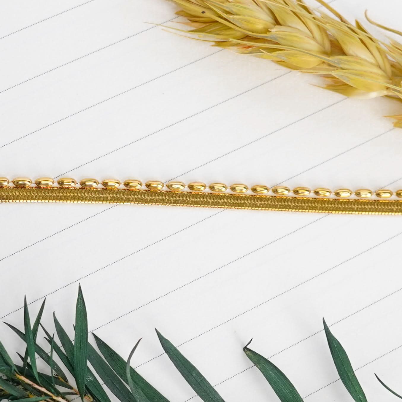 Gilded Ribbon & Orb Duo Bracelet – pre-stacked flat snake chain and oval-bead strand bracelet in 18K gold plated finish-8