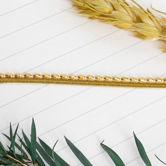 Gilded Ribbon & Orb Duo Bracelet – pre-stacked flat snake chain and oval-bead strand bracelet in 18K gold plated finish-8