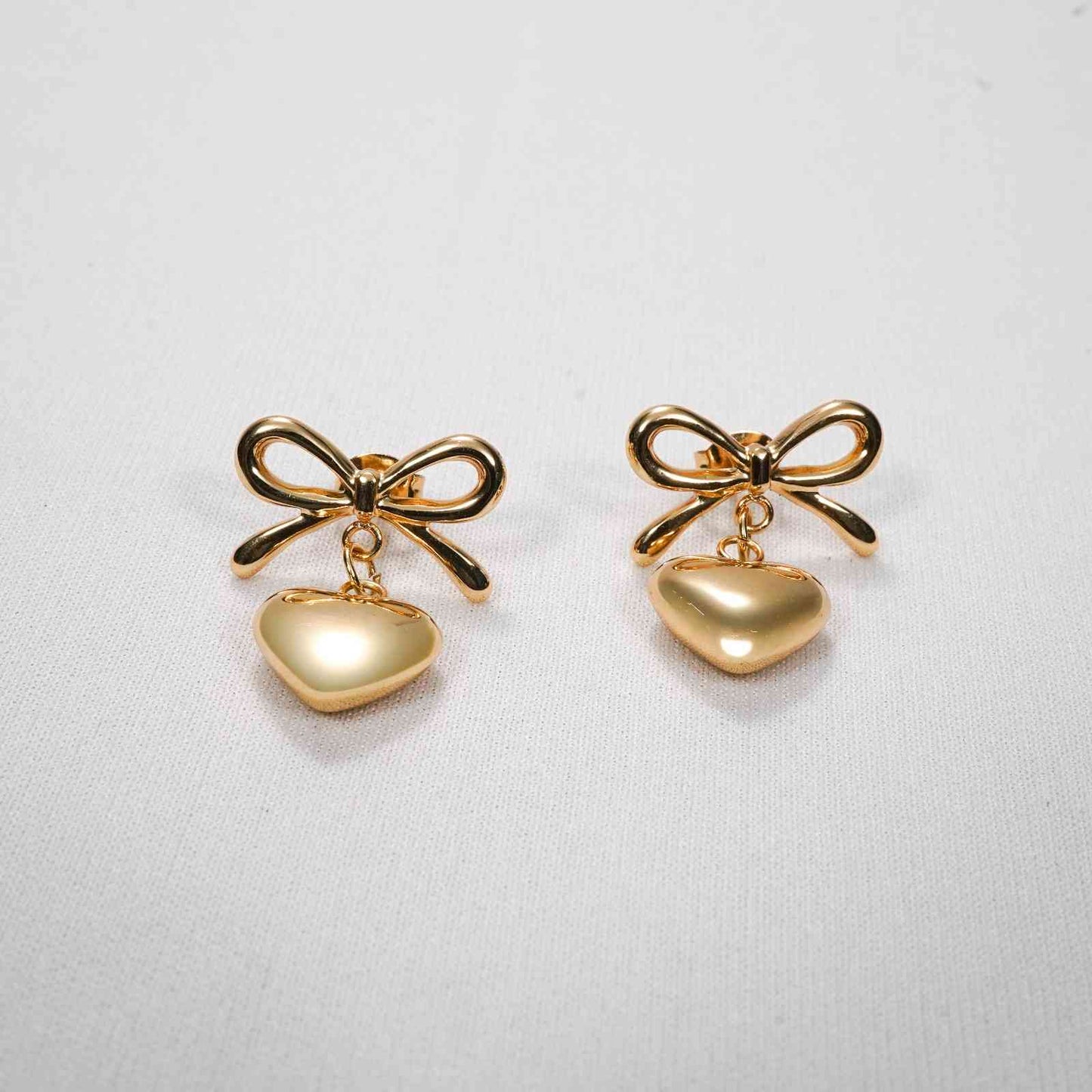Gold Bow Knot & Heart Drop Earrings – bow knot and hanging heart drop earrings in 18K gold PVD for women-2