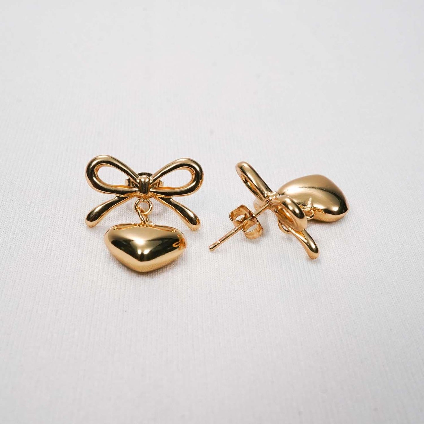 Gold Bow Knot & Heart Drop Earrings – bow knot and hanging heart drop earrings in 18K gold PVD for women-3