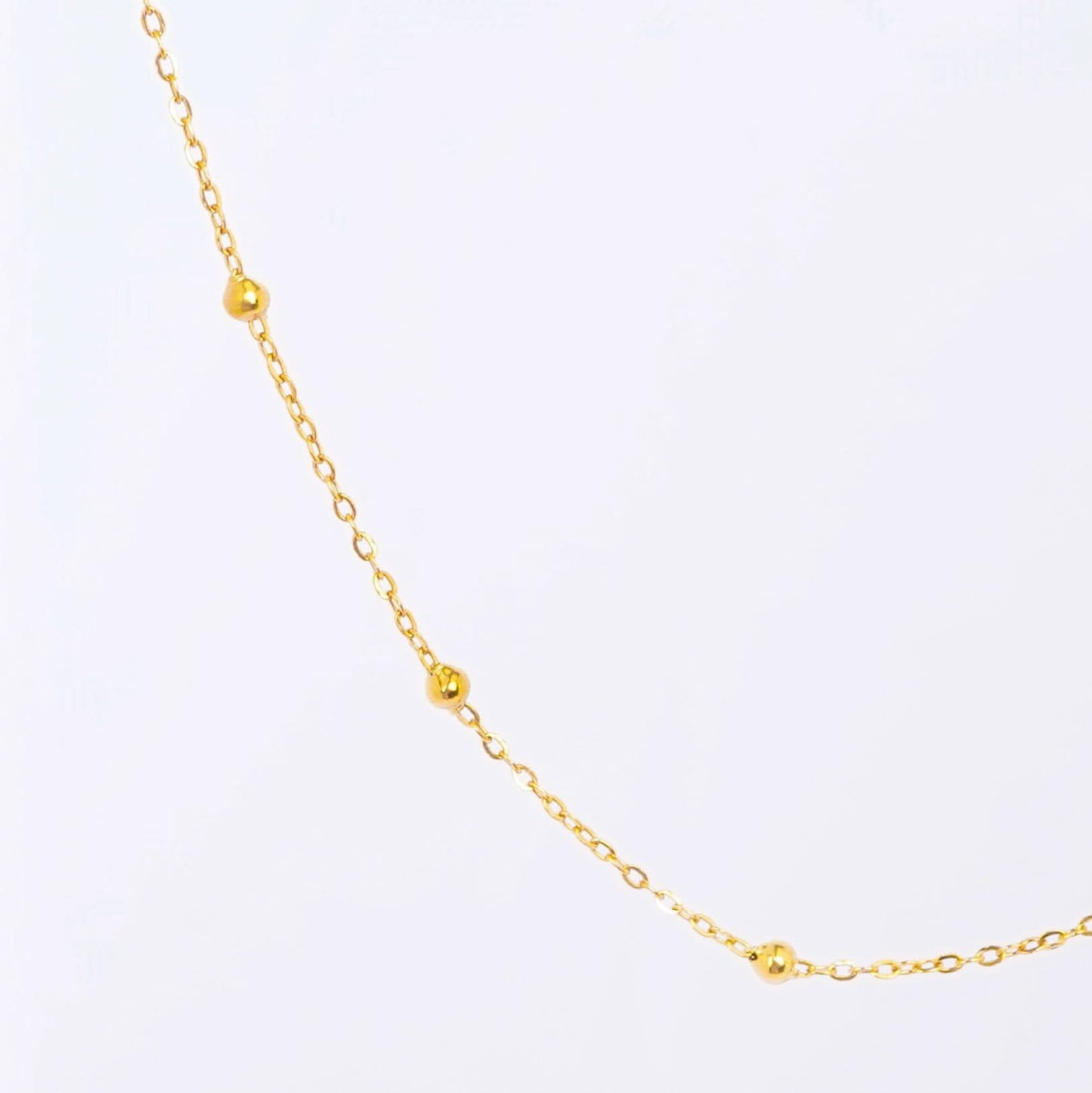 Gold Dainty Station Pendant Necklace – close-up of the delicate station pendant charms