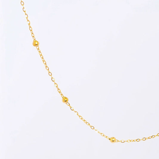 Gold Dainty Station Pendant Necklace – close-up of the delicate station pendant charms