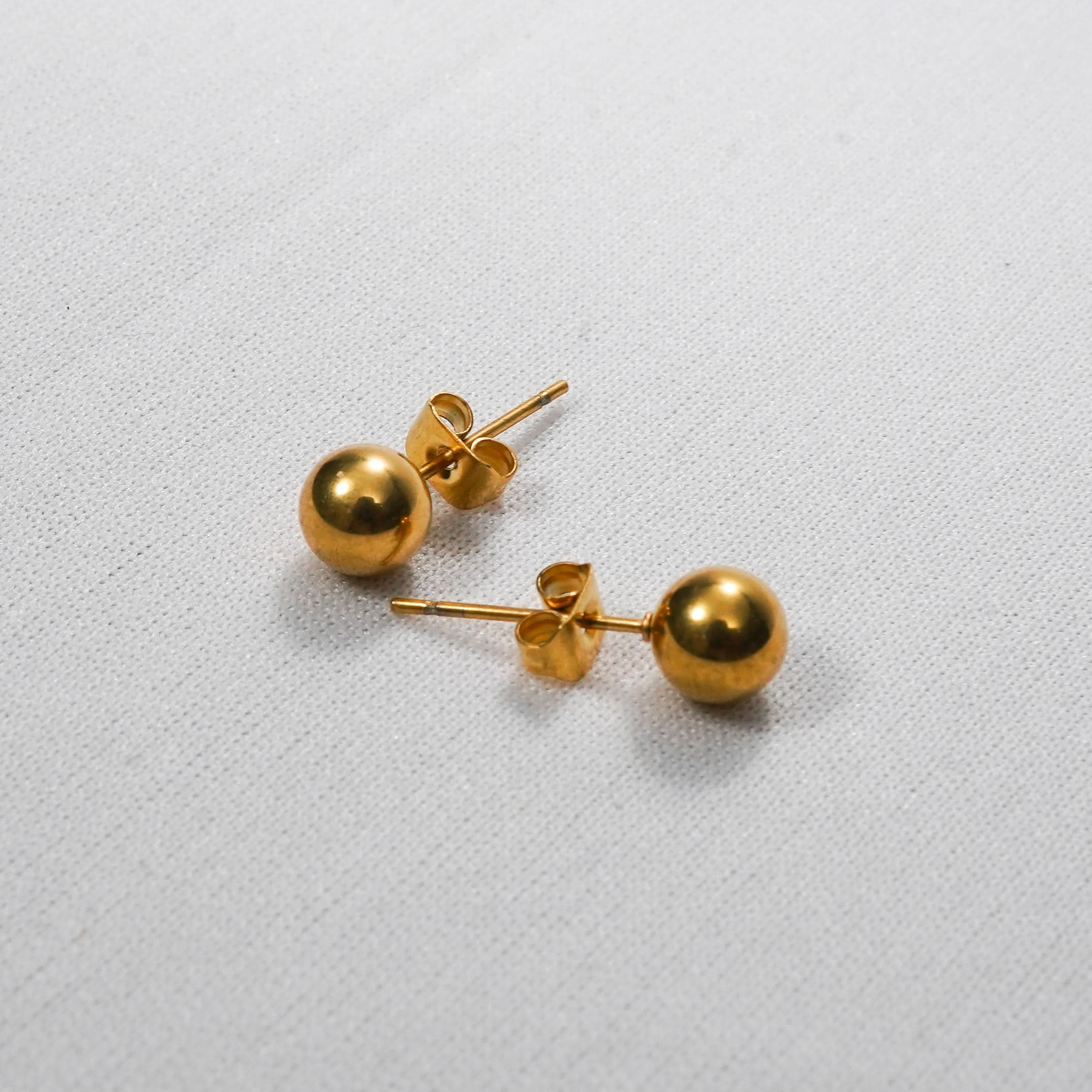 Gold Dome Stud Earrings – close-up of the high-shine convex dome surface