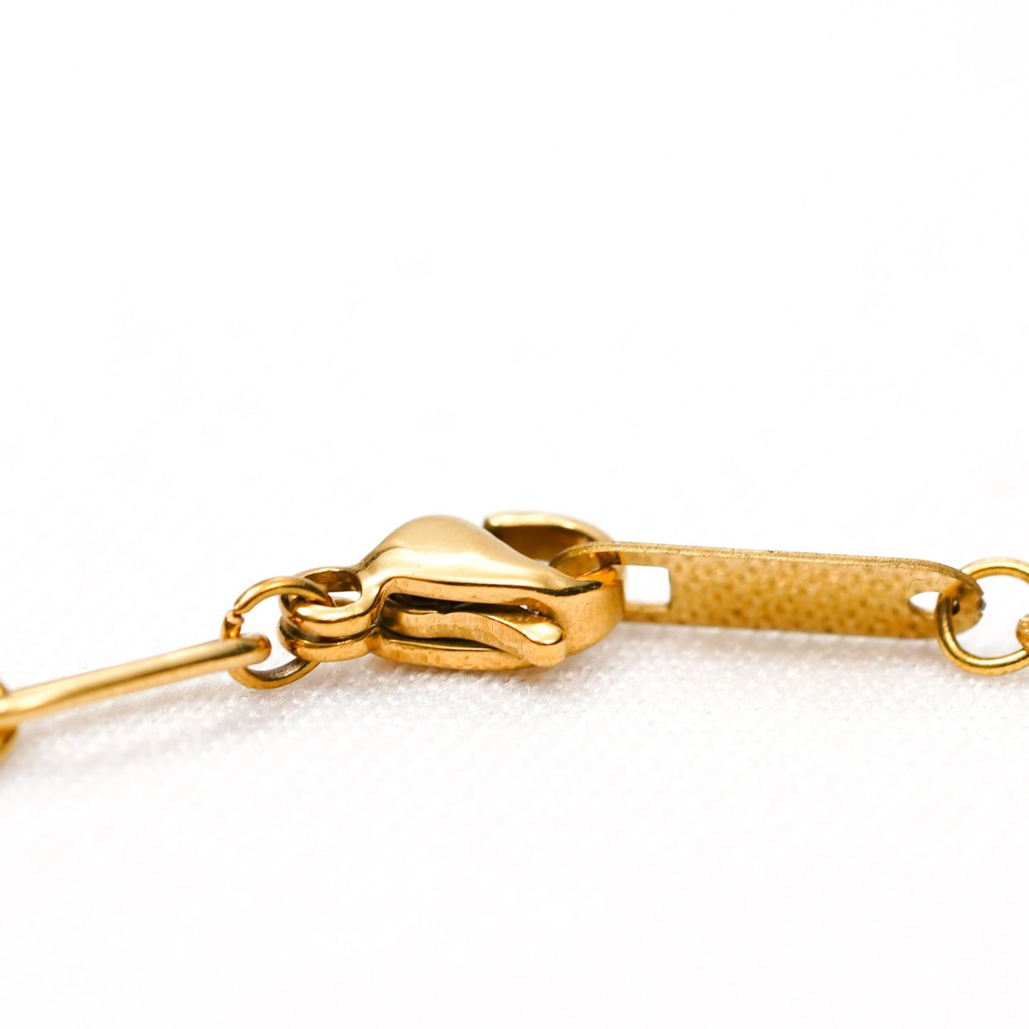 Gold Geometric Bracelet – worn on wrist, minimal structured gold bracelet