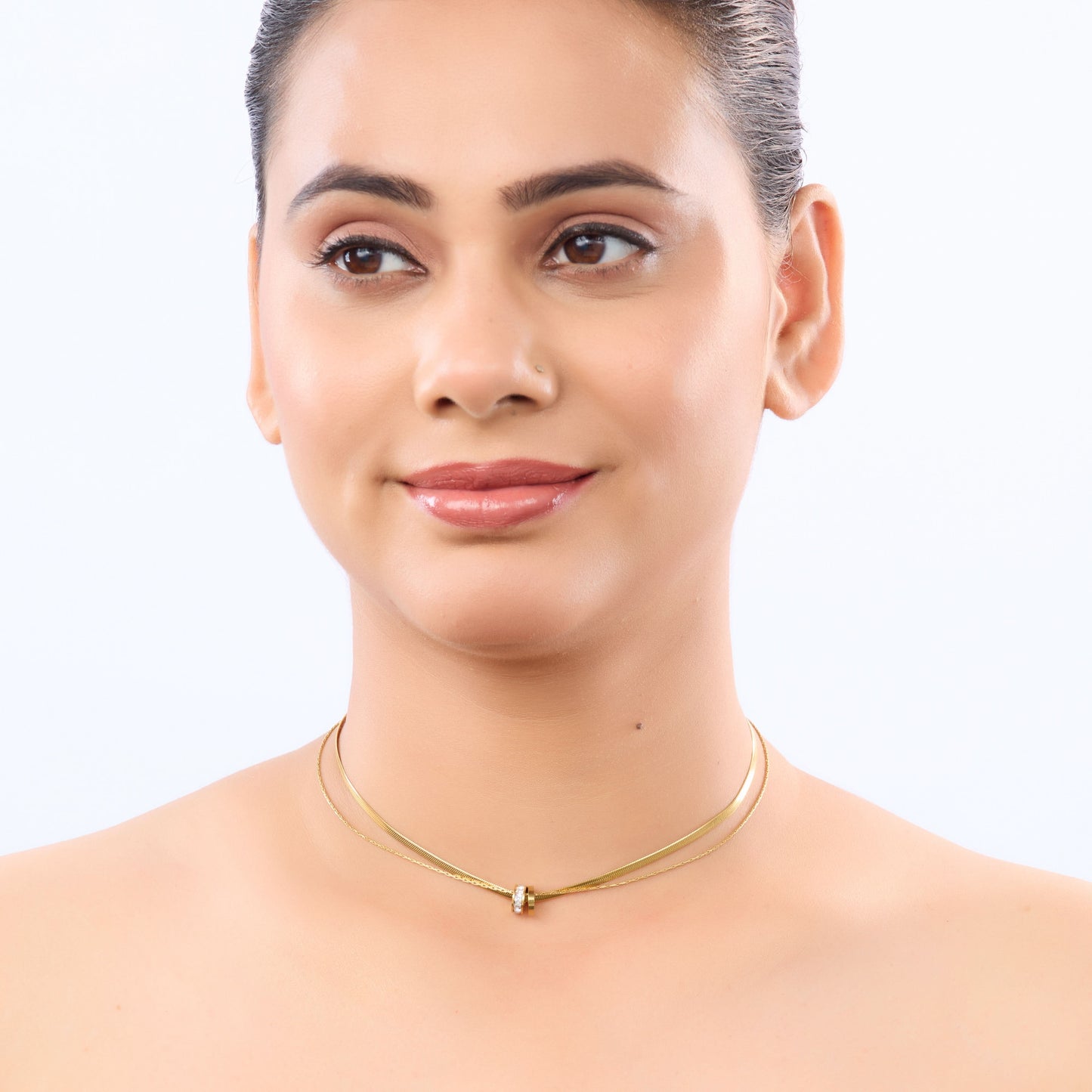 Golden Aura Double-Layer Necklace – worn on neckline, warm golden aura finish