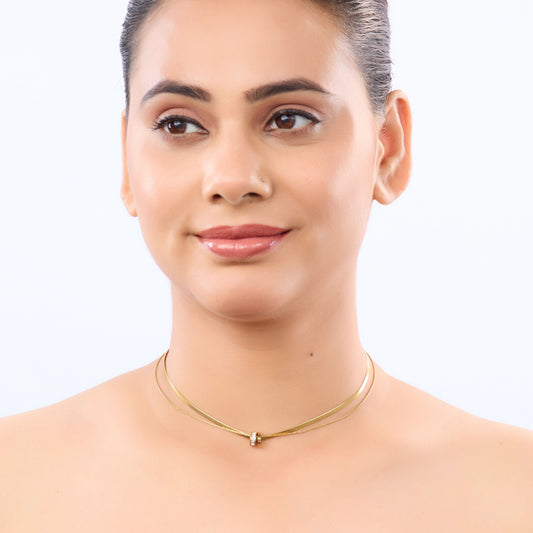 Golden Aura Double-Layer Necklace – worn on neckline, warm golden aura finish