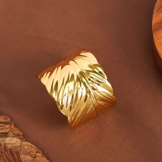 Golden Aura Feather Bracelet – worn on wrist, golden aura feather charm bracelet