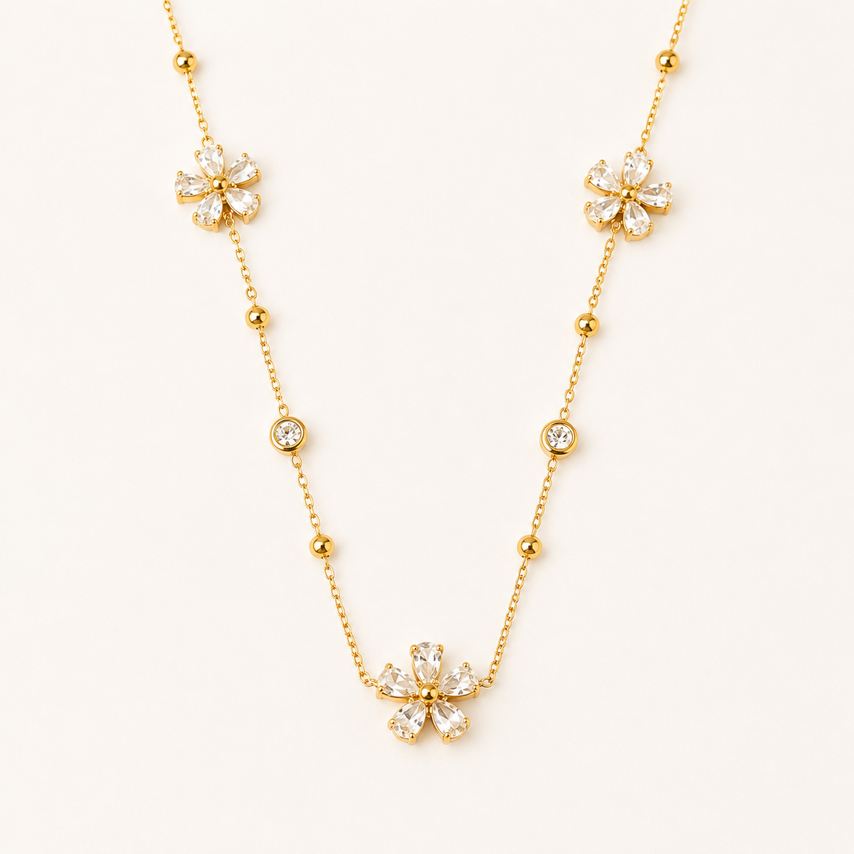 Golden Blossom Crystal Necklace – blossom-shaped crystal pendant necklace in 18K gold plated finish for women