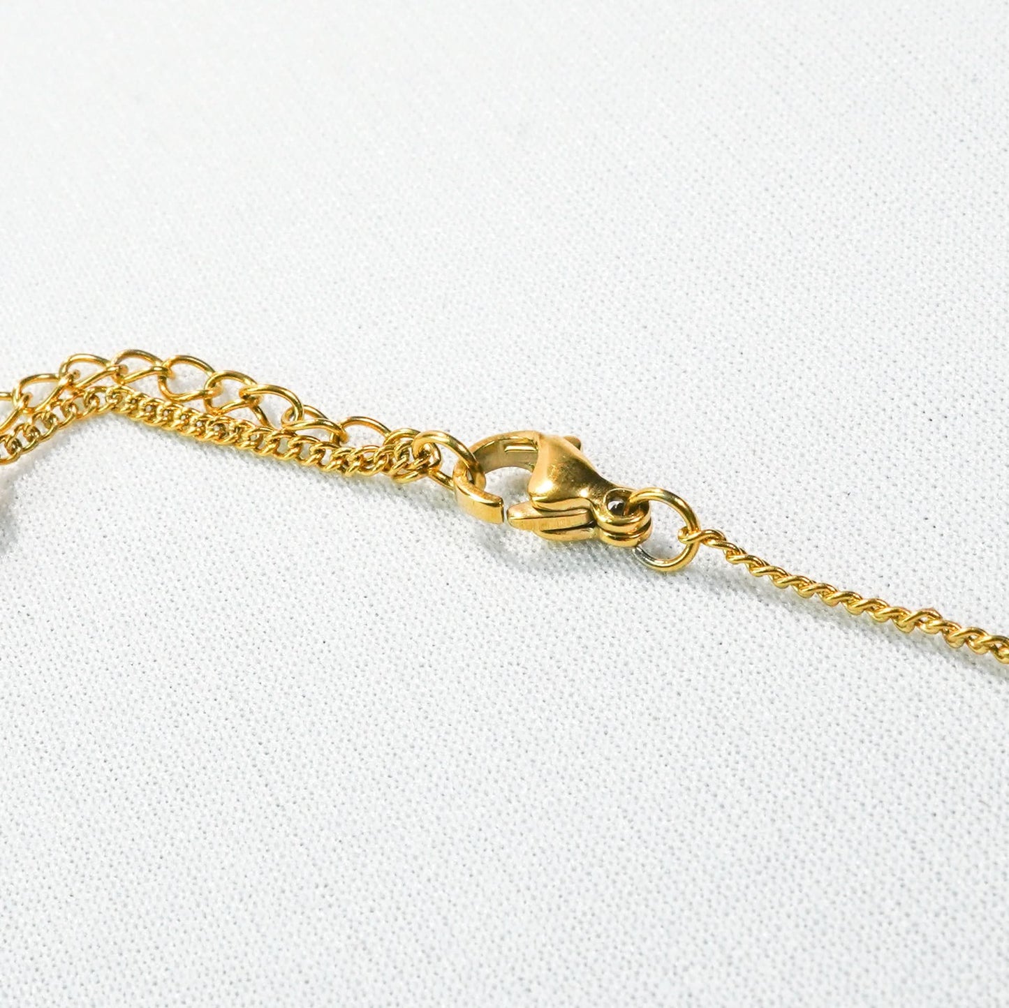 Golden Bow Charm Necklace – worn on neckline, street-style bow charm necklace