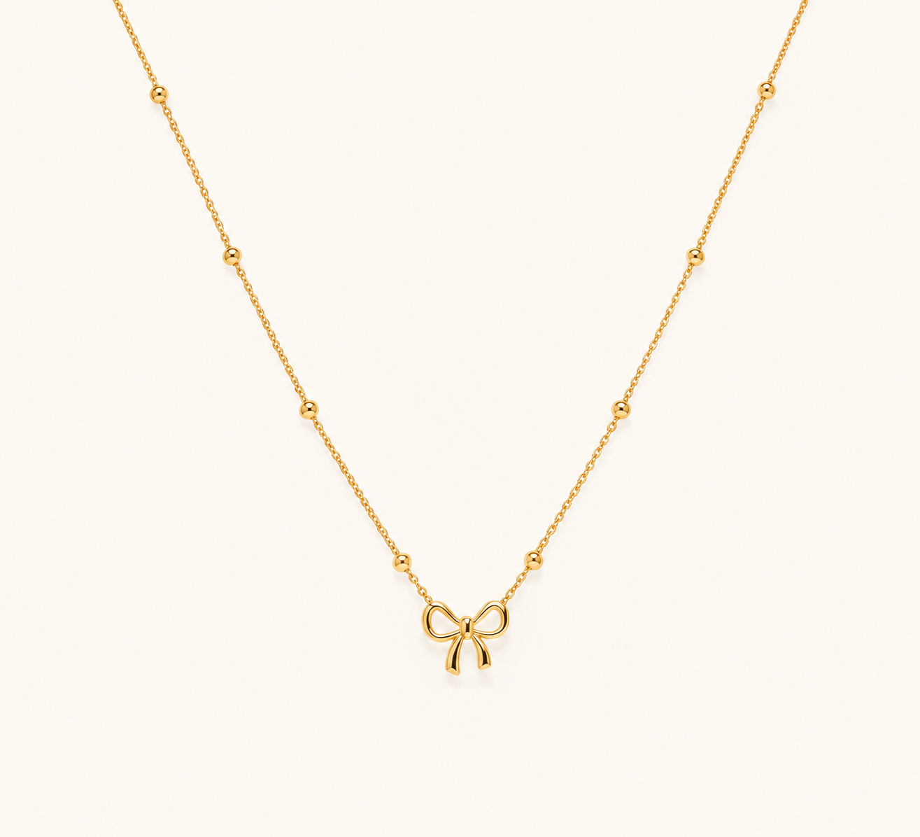 Golden Bow Charm Necklace – playful bow knot gold plated charm necklace for women