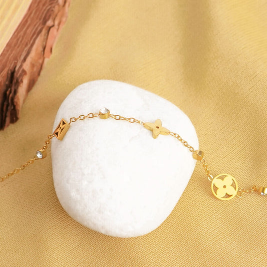 Golden Charm Symphony Bracelet – close-up of the mixed charm cluster
