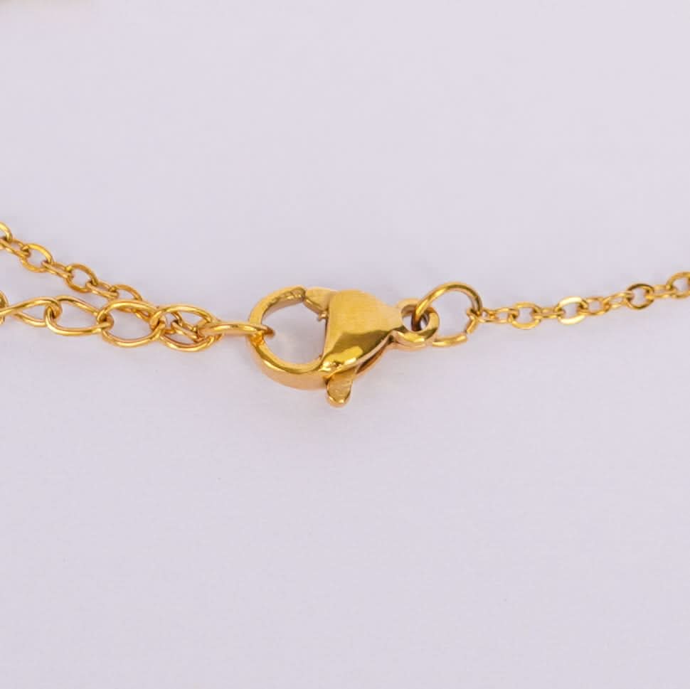 Golden Charm Symphony Bracelet – worn on wrist, harmonious multi-charm bracelet
