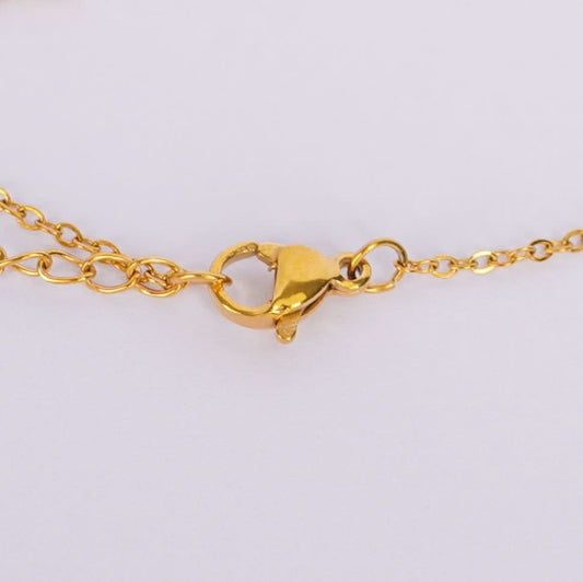 Golden Charm Symphony Bracelet – worn on wrist, harmonious multi-charm bracelet