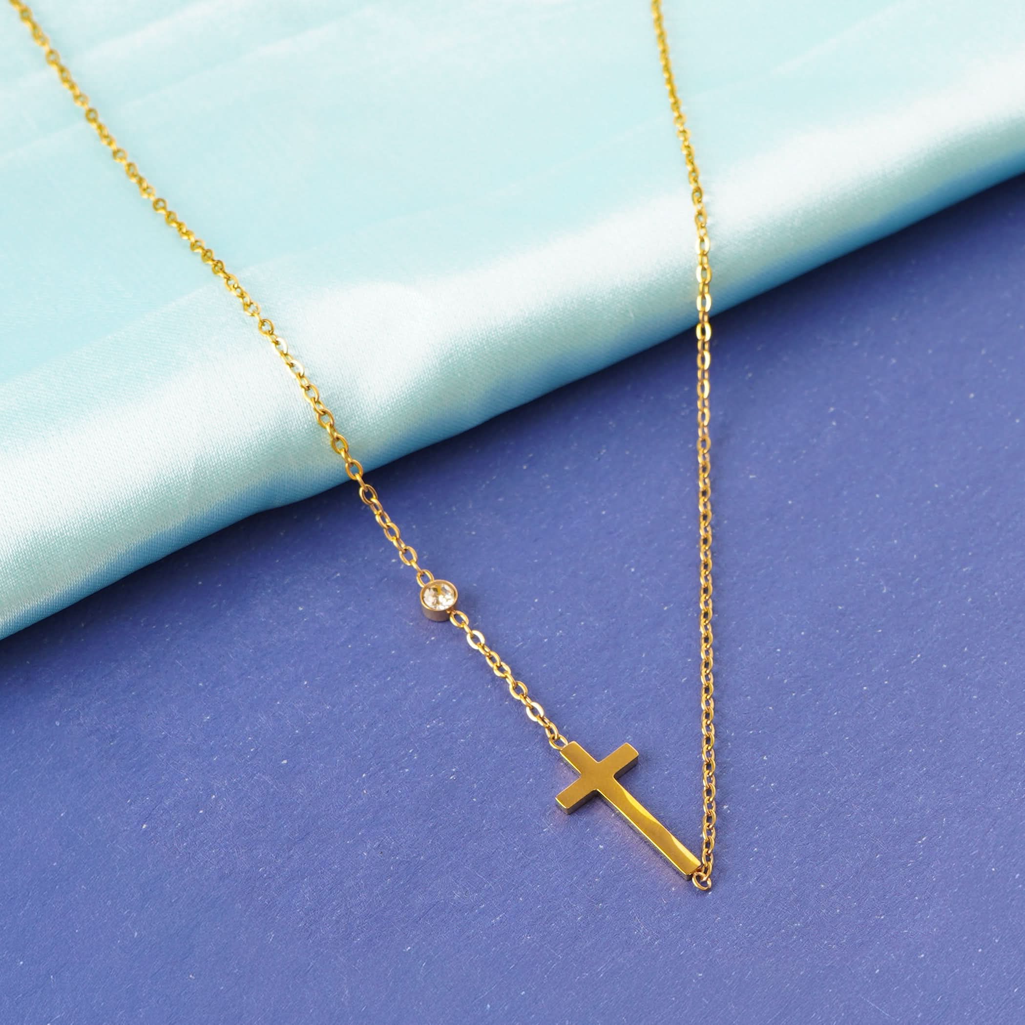 Golden Cross Elegance Necklace – worn on neckline, minimalist gold cross necklace