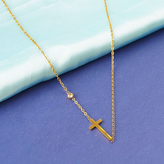 Golden Cross Elegance Necklace – worn on neckline, minimalist gold cross necklace